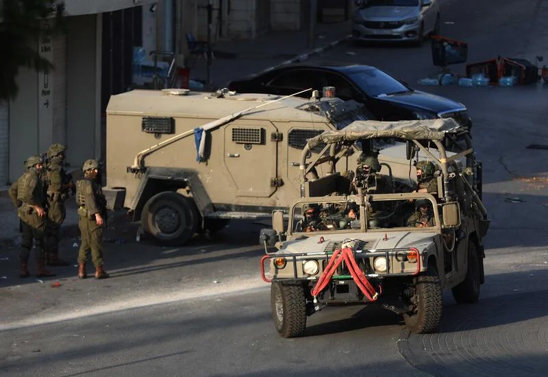 Israeli soldiers take part in a military operation in the West Bank city