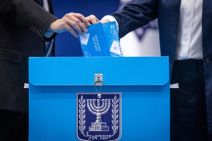 Israeli president Isaac Herzog casts his ballot at a polling station in Jerusalem, during Election Day in Israel