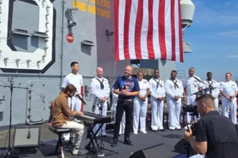 Former israeli hostage Alon Ohel performs aboard the USS Nimitz as part of US Independence Day celebrations