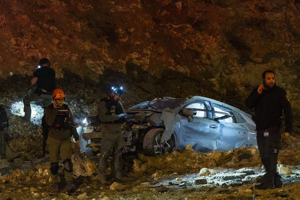 Israeli security and rescue forces operate at the scene where a ballistic missile fired from Iran struck a car in Jerusalem amid the war with Iran and ongoing missile fire toward Israel, March 1, 2026. (Photo: Yonatan Sindel/Flash90)