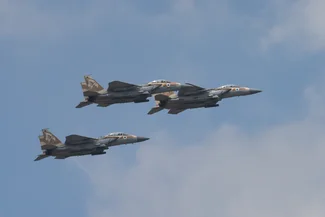 Three israeli air force McDonnell Douglas F-15 Eagle aircrafts, flying in a hazy sky. May 5, 2022, Jerusalem, Israel Photo: Shutterstock