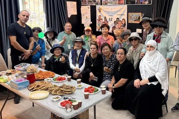 The Christian delegation with Druze families in Majdal Shams (Photo courtesy)